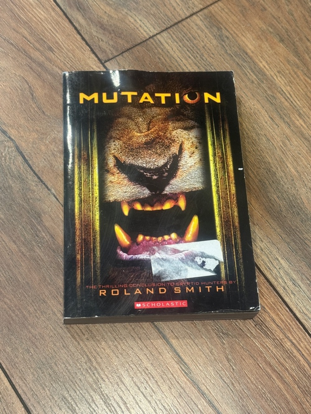 Mutation by Roland Smith - Dark Animal Cover (Black, Gold, Orange)